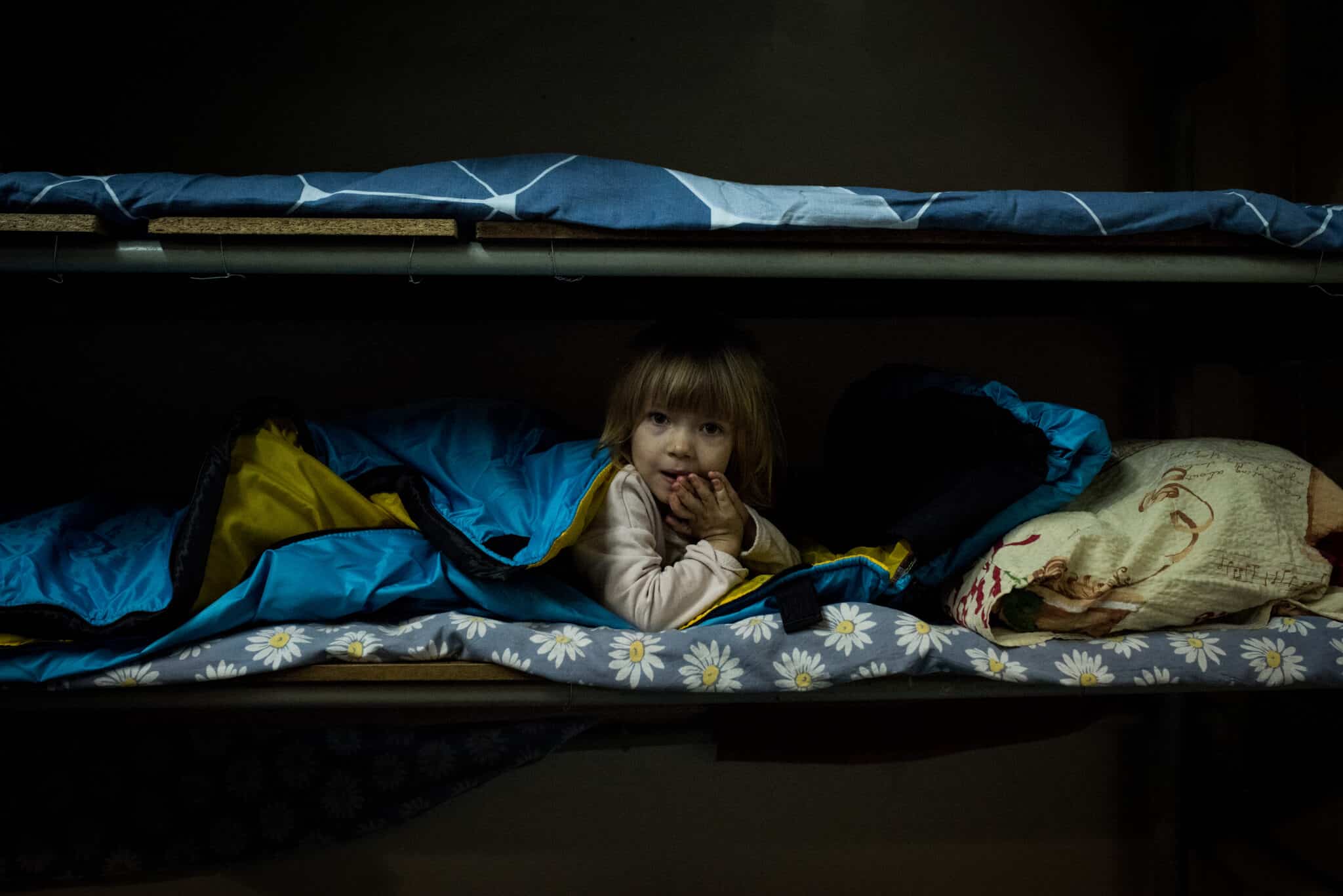 Child playing in bomb shelter in Ukraine.